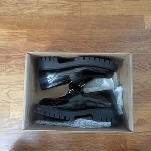 Steve Madden Glossy Black Loafers with Gold Detail